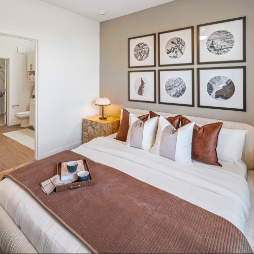 a bedroom with a bed and two nightstands