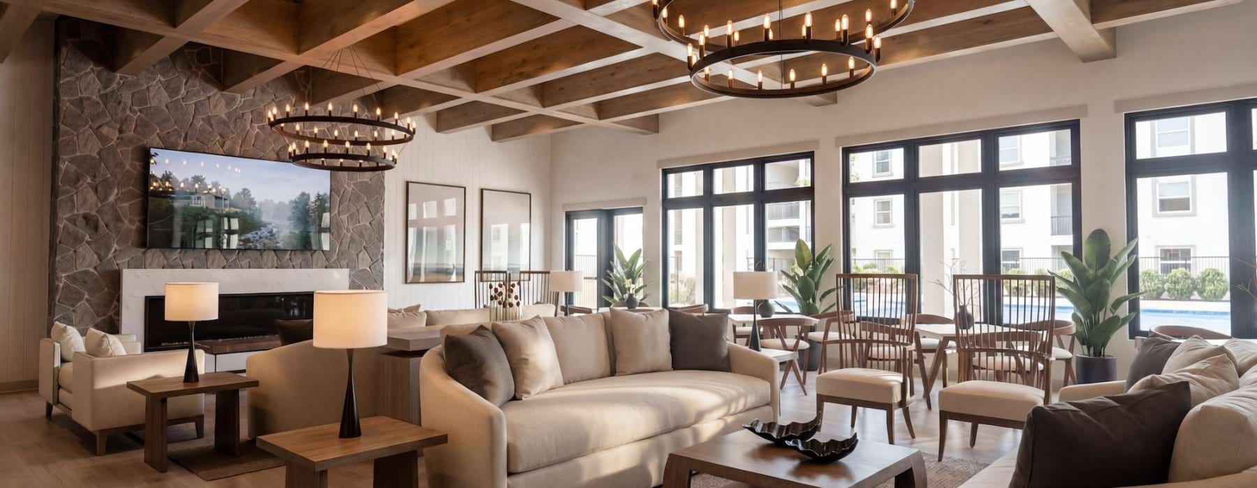 a lounge with sofas and a large fireplace and tv