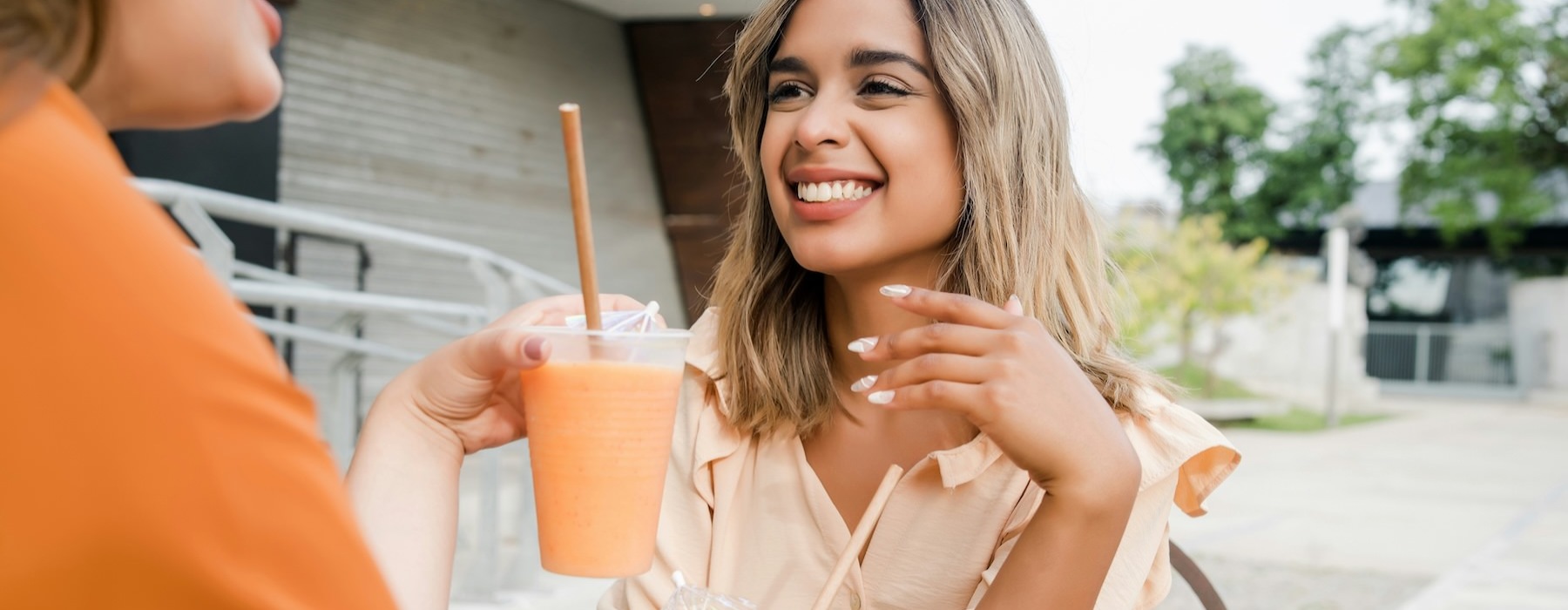 a woman holding a drink
