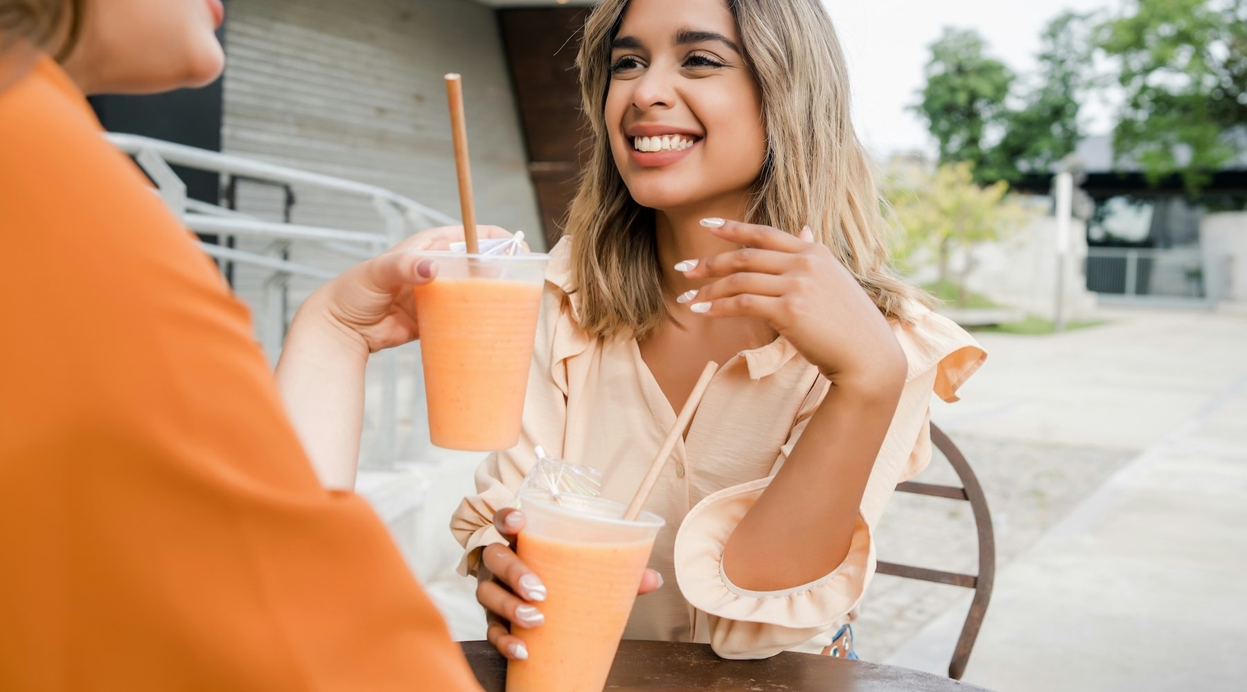 a woman holding a drink