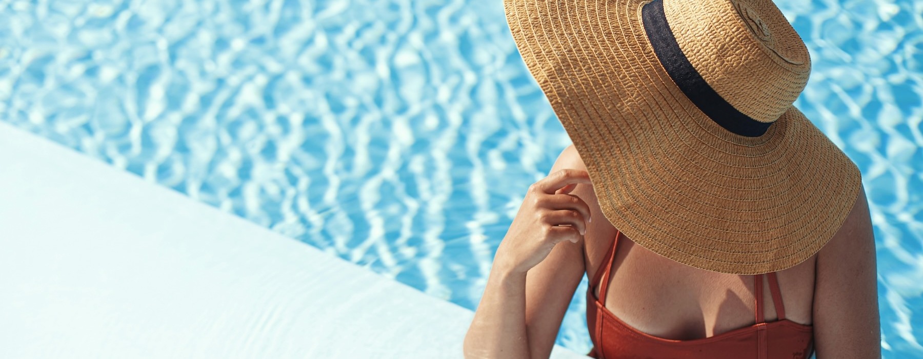 a person wearing a hat in a pool