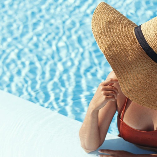 a person wearing a hat in a pool